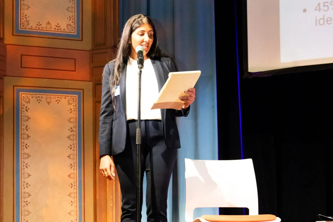 Dr. Pegah Faed, Safe & Sound CEO reading her welcome speech.